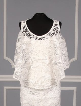 This beautiful Austin Scarlett Scarlett Collection Nadine E017 wedding dress is Brand New and has its hang tag attached!  The gown has two looks in one!  You can wear the removable cape or you can simply wear the spaghetti strap gown without the cape.  The trumpet silhouette flows into a short sweep train.  Gorgeous branch lace makes this Austin Scarlett wedding dress such a couture creation!