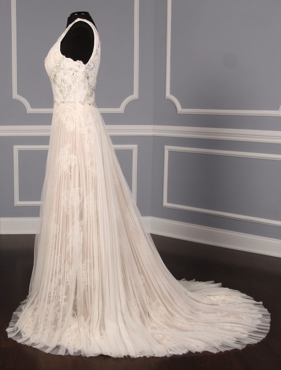 This gorgeous Isabelle Armstrong Willow wedding dress is Brand New!  This wedding gown is truly a work of art!!  You will be in awe when you see how incredible this gown is in person.  It is made from luxurious French Alencon Lace with an overlay of English Net and beading on the bodice.  The outer fabrics are silk white (diamond white) and the lining is a nude color.  The sleeveless v-neck and v-back bodices flow into an a-line silhouette with a chapel train.