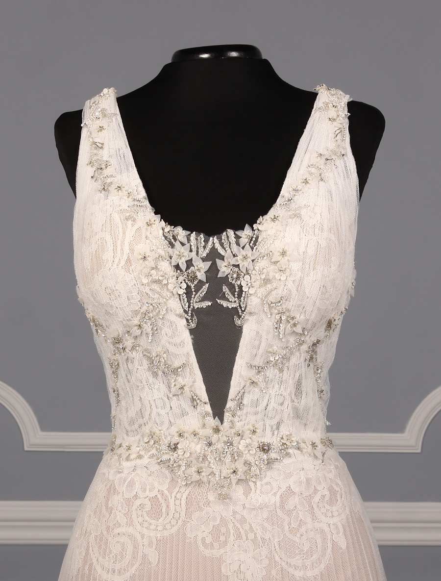 This gorgeous Isabelle Armstrong Willow wedding dress is Brand New!  This wedding gown is truly a work of art!!  You will be in awe when you see how incredible this gown is in person.  It is made from luxurious French Alencon Lace with an overlay of English Net and beading on the bodice.  The outer fabrics are silk white (diamond white) and the lining is a nude color.  The sleeveless v-neck and v-back bodices flow into an a-line silhouette with a chapel train.