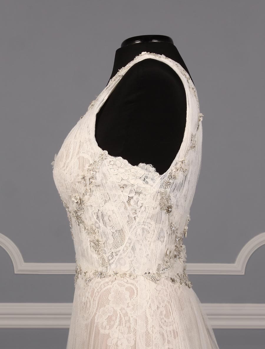 This gorgeous Isabelle Armstrong Willow wedding dress is Brand New!  This wedding gown is truly a work of art!!  You will be in awe when you see how incredible this gown is in person.  It is made from luxurious French Alencon Lace with an overlay of English Net and beading on the bodice.  The outer fabrics are silk white (diamond white) and the lining is a nude color.  The sleeveless v-neck and v-back bodices flow into an a-line silhouette with a chapel train.