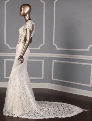 This beautiful Reem Acra Cheri 5624 wedding dress is Brand New!  The wedding gown is absolutely amazing in person!  It has cap sleeves, a natural waistline, a sweetheart neckline, sheer back & a sheath silhouette.  The train is chapel length.  The lace is luxurious with clear beads on the front and back bodice that add the perfect touch of sparkle!