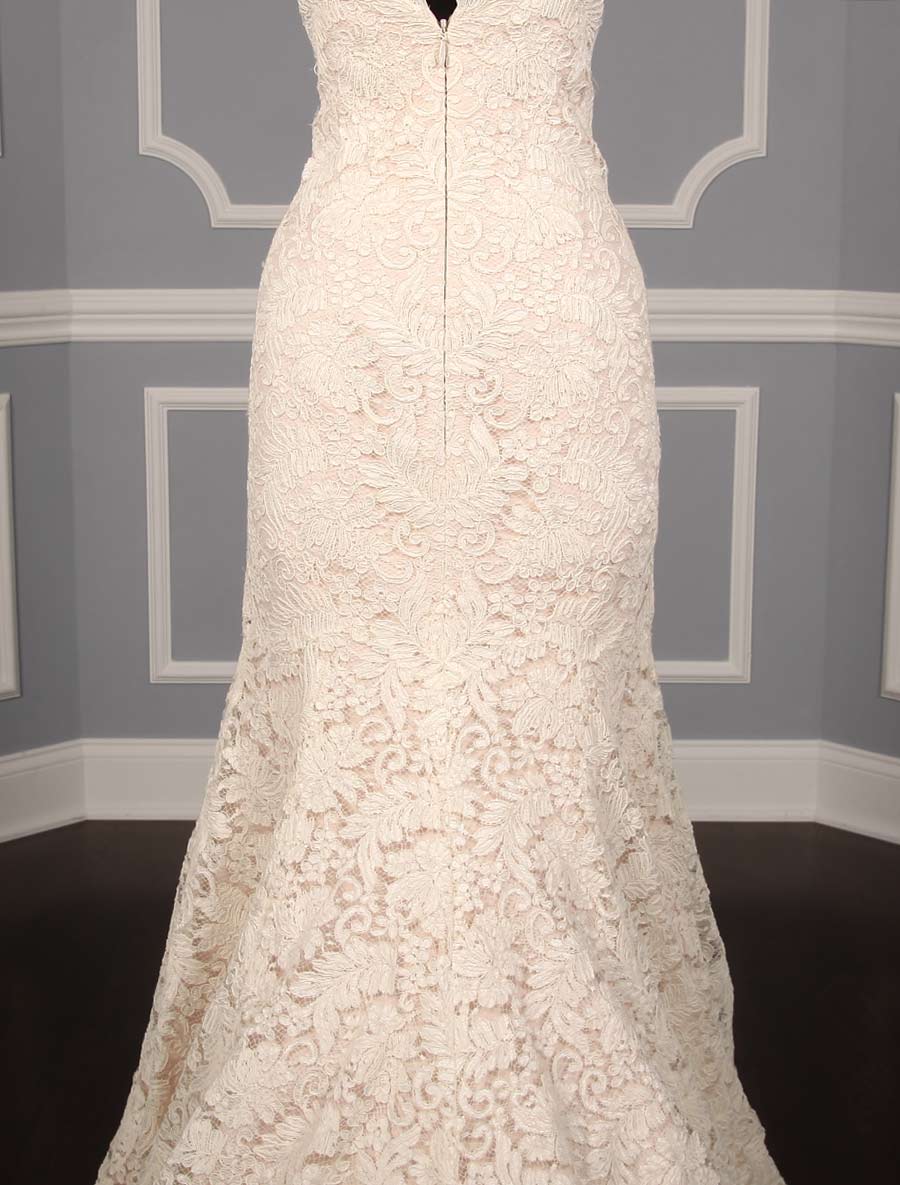 This elegant, lace Romona Keveza Legends L7131 wedding dress is Brand New!  Soft blush lining gives this gown the perfect touch of soft pink color.  The French Alencon lace is gorgeous and creates an asymmetrical, strapless neckline.  A trumpet silhouette flows into a sweep train.  You will be able to move and dance easily in this Romona Keveva wedding dress.