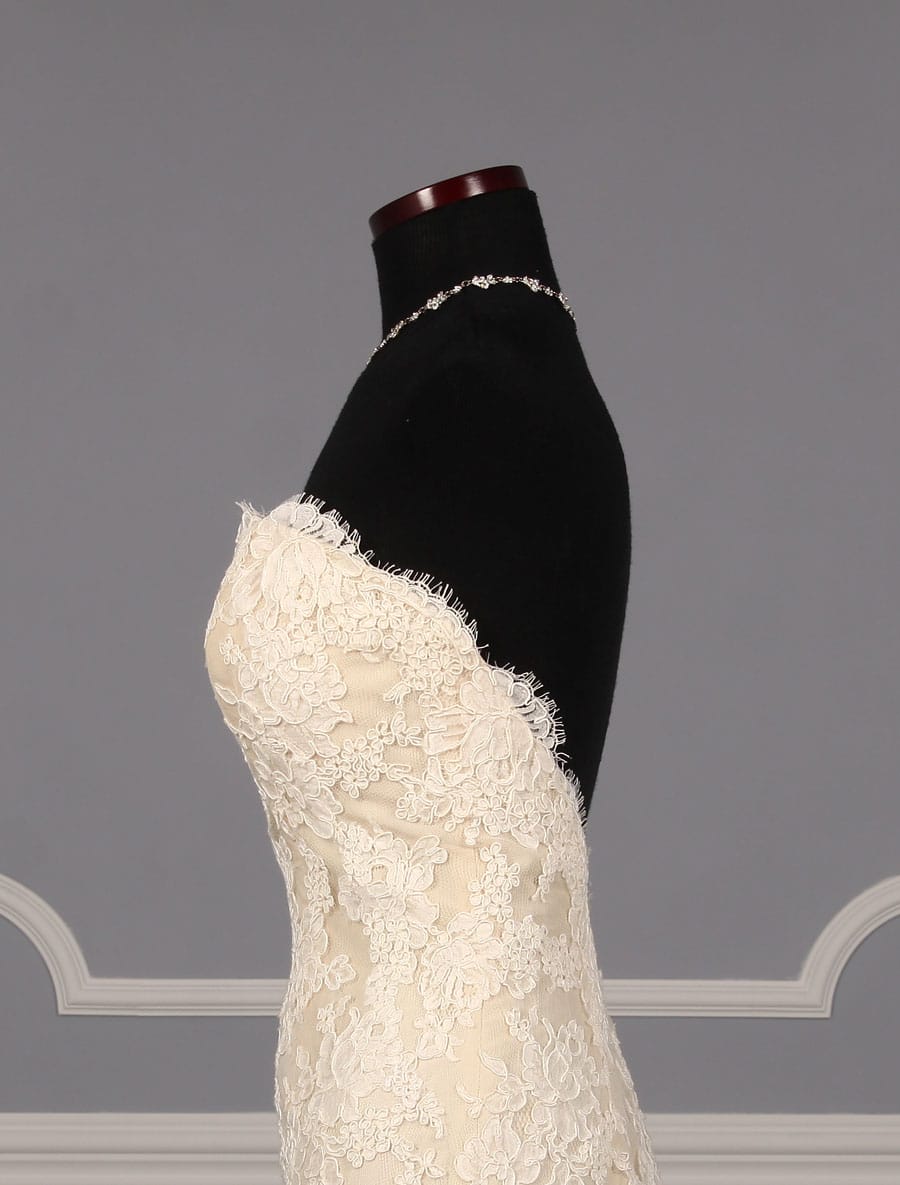 This beautiful Ines Di Santo Manye wedding dress is New!  The French Alencon Lace is absolutely amazing in person!  The lace is ivory and the taffeta lining is antique ivory, which is a warm ivory.  This Manye lace wedding gown is strapless with a sweetheart neckline, a trumpet / mermaid silhouette and a chapel train.  Such a timeless and classic style wedding gown! 