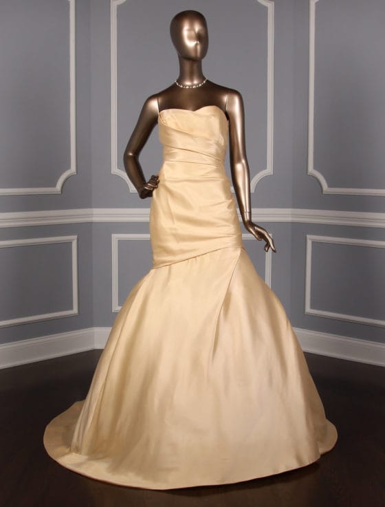 This beautiful Monique Lhuillier Austen wedding dress is Brand New!  If you are looking for an elegant wedding gown that isn't the traditional ivory or diamond white, then look now further!  This Monique Lhuillier wedding dress is perfect for any wedding venue.  The gold silk satin fabric has some stretch for a comfortable fit.  The strapless bodice has a draped look that is fitted through the hips with a trumpet silhouette and a sweep train. 