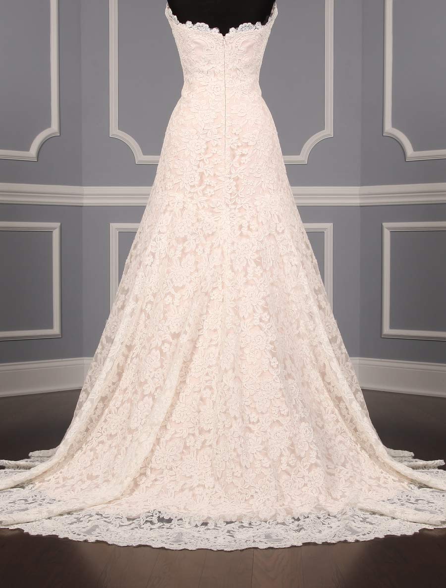 This lace Romona Keveza Legends L503 wedding dress is Brand New!  The gown has ivory re-embroidered lace and blush lining.  Such an elegant color combination!  This Romona Keveza strapless wedding gown has a scalloped neckline and hem, an a-line silhouette and a chapel train.