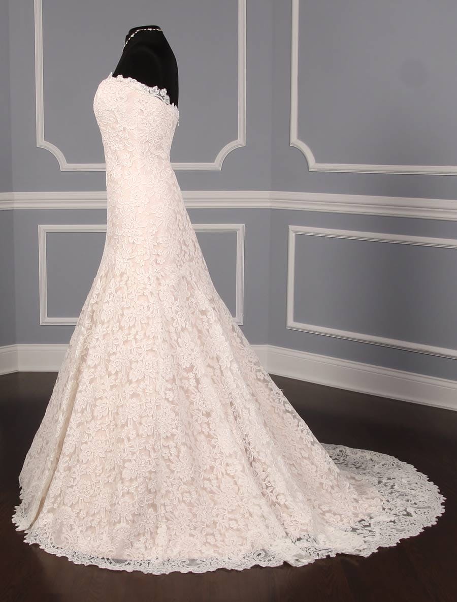 This lace Romona Keveza Legends L503 wedding dress is Brand New!  The gown has ivory re-embroidered lace and blush lining.  Such an elegant color combination!  This Romona Keveza strapless wedding gown has a scalloped neckline and hem, an a-line silhouette and a chapel train.