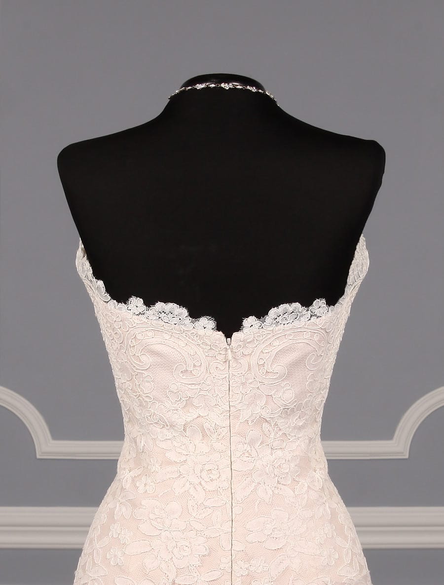This lace Romona Keveza Legends L503 wedding dress is Brand New!  The gown has ivory re-embroidered lace and blush lining.  Such an elegant color combination!  This Romona Keveza strapless wedding gown has a scalloped neckline and hem, an a-line silhouette and a chapel train.