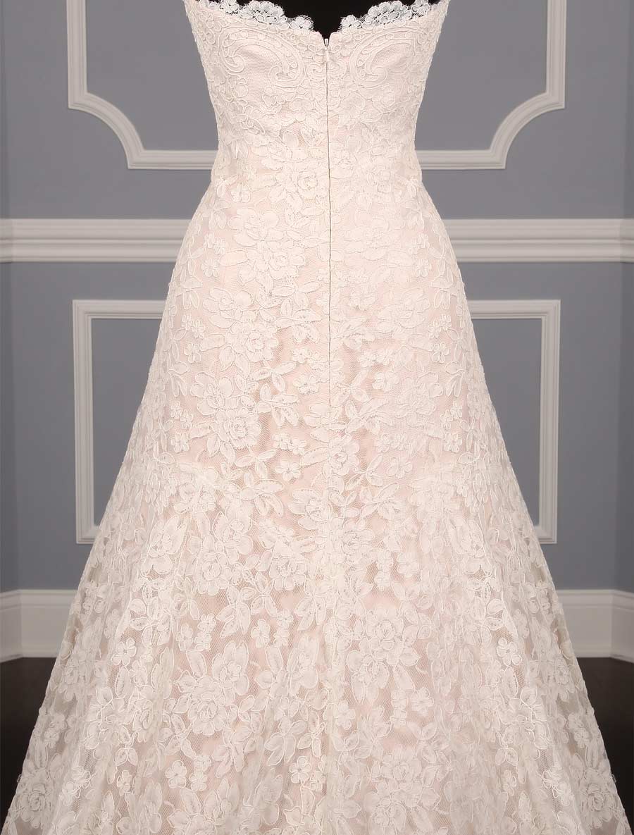 This lace Romona Keveza Legends L503 wedding dress is Brand New!  The gown has ivory re-embroidered lace and blush lining.  Such an elegant color combination!  This Romona Keveza strapless wedding gown has a scalloped neckline and hem, an a-line silhouette and a chapel train.