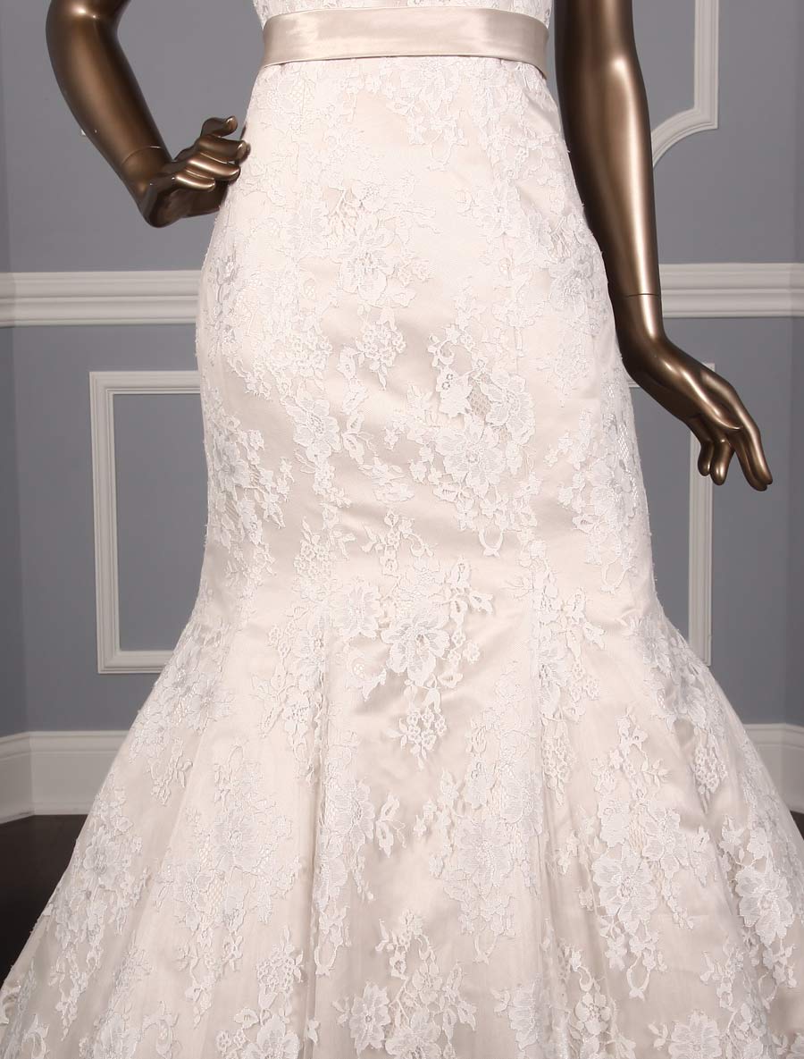 This Allure Bridal 9117 wedding dress is Brand New and has its hang tag attached!  The gown can be worn strapless, or if you like you can add the included spaghetti straps.  Either way, the gown is gorgeous and comfortable to wear for hours and hours.  The champagne lining shows through the ivory lace giving the Allure wedding gown a soft touch of color.  This wedding dress is strapless with a luxurious champagne satin sash at the waist, a trumpet silhouette and a chapel train.  If you prefer, the champagne sash can be removed.