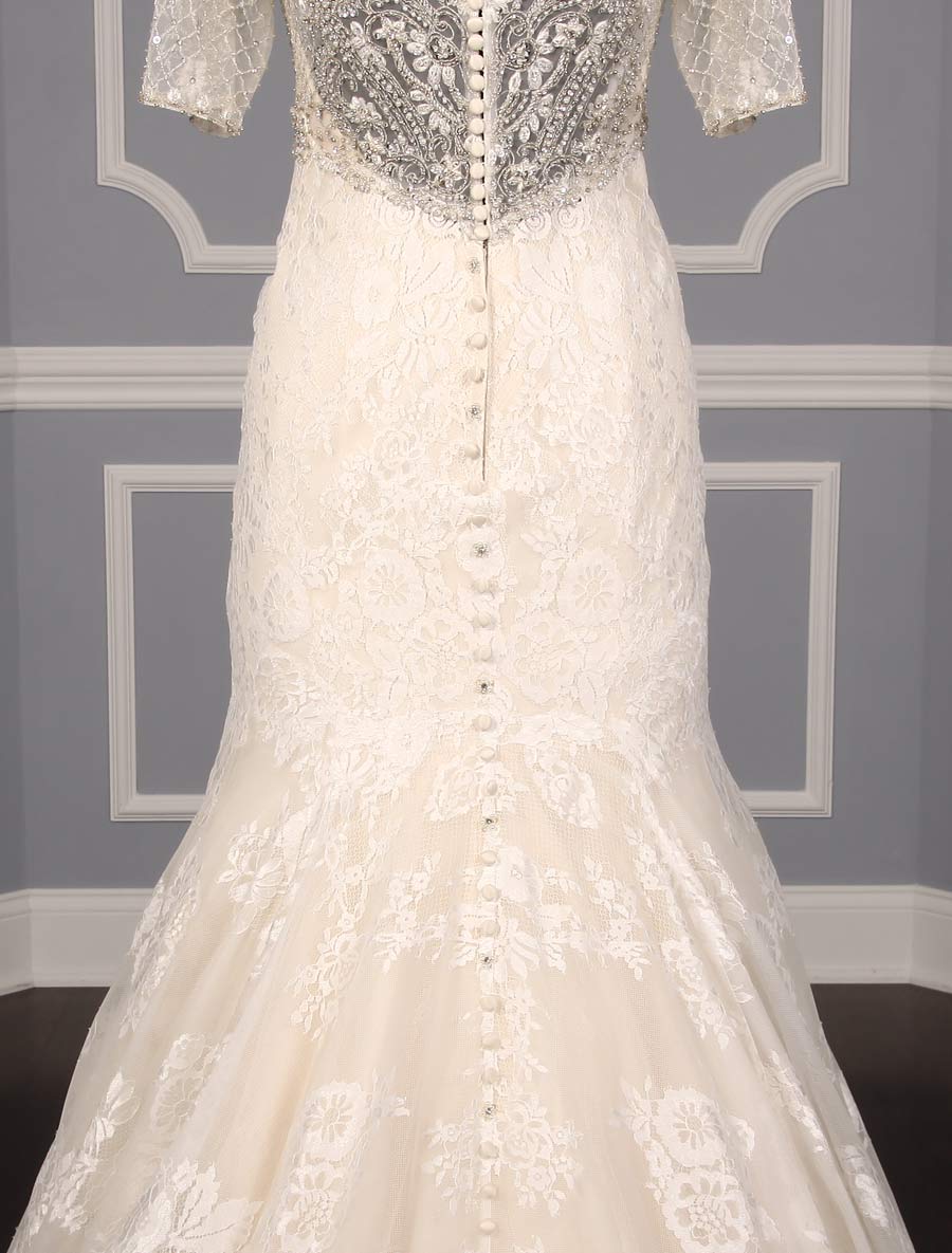 This Allure C341 wedding dress is Brand New and has its hang tag attached!  The workmanship on this gown is amazing in person!  The beading and embroidery on the bodice are out of this world!  Luxurious lace creates the fit and flare design of this Allure wedding gown.  The light gold lining shows through giving the gown a soft touch of color.  There are sheer short sleeves, a sheer back, an empire waist and a trumpet silhouette that flows into a chapel train.