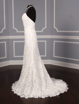 This Isabelle Armstrong Georgia X wedding dress is Brand New!  The gown is made from luxurious off white (light ivory) lace.  It has a sheer illusion halter neck with a low back, trumpet silhouette and a sweep train.  This Isabelle Armstrong wedding gown is extremely elegant and perfect for any type of wedding venue.