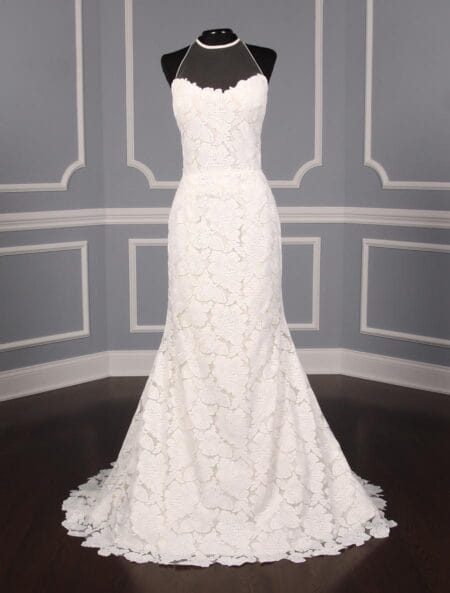 This Isabelle Armstrong Georgia X wedding dress is Brand New!  The gown is made from luxurious off white (light ivory) lace.  It has a sheer illusion halter neck with a low back, trumpet silhouette and a sweep train.  This Isabelle Armstrong wedding gown is extremely elegant and perfect for any type of wedding venue.