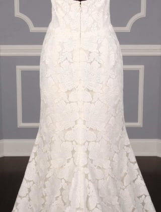 This Isabelle Armstrong Georgia X wedding dress is Brand New!  The gown is made from luxurious off white (light ivory) lace.  It has a sheer illusion halter neck with a low back, trumpet silhouette and a sweep train.  This Isabelle Armstrong wedding gown is extremely elegant and perfect for any type of wedding venue.