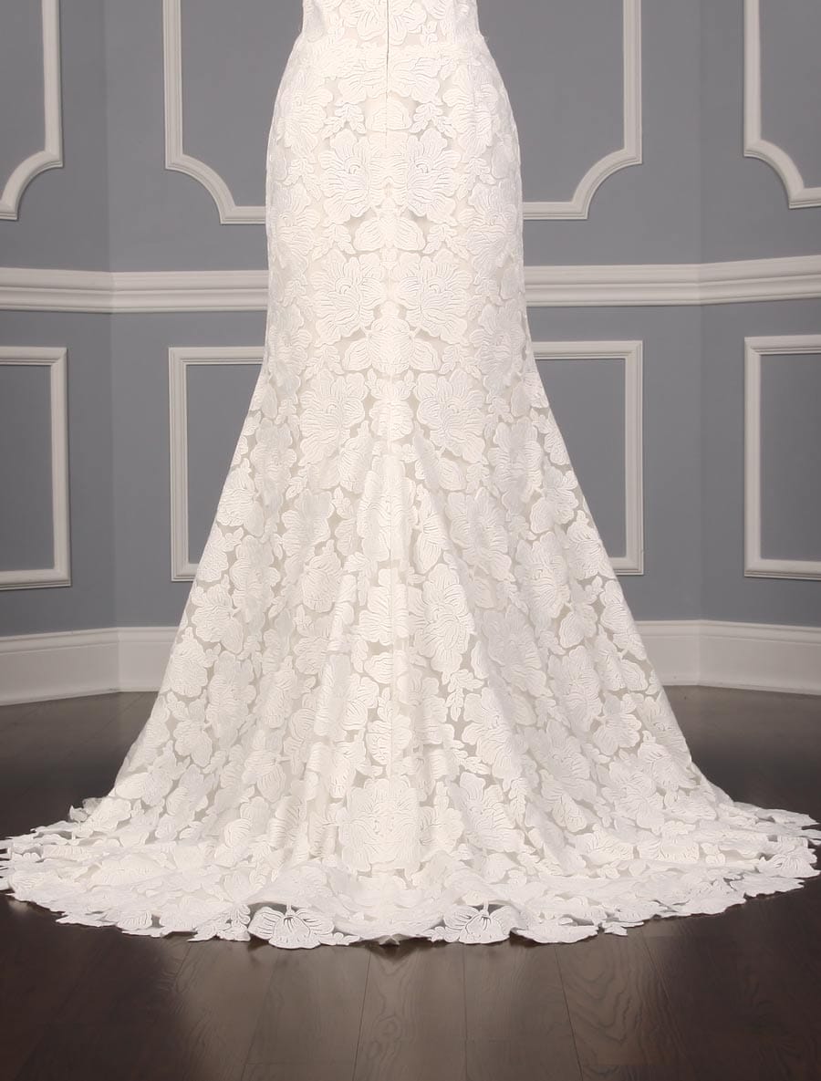 This Isabelle Armstrong Georgia X wedding dress is Brand New!  The gown is made from luxurious off white (light ivory) lace.  It has a sheer illusion halter neck with a low back, trumpet silhouette and a sweep train.  This Isabelle Armstrong wedding gown is extremely elegant and perfect for any type of wedding venue.