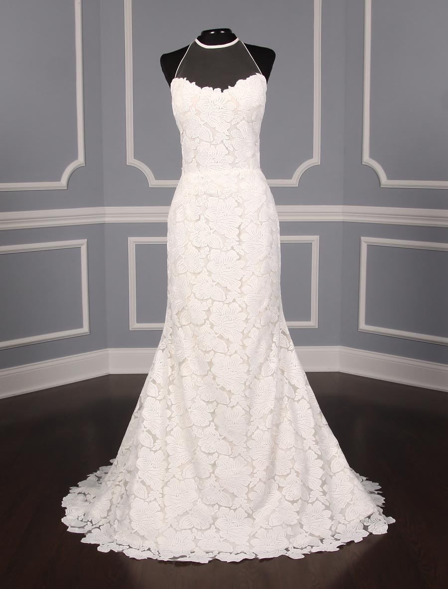 This Isabelle Armstrong Georgia X wedding dress is Brand New!  The gown is made from luxurious off white (light ivory) lace.  It has a sheer illusion halter neck with a low back, trumpet silhouette and a sweep train.  This Isabelle Armstrong wedding gown is extremely elegant and perfect for any type of wedding venue.