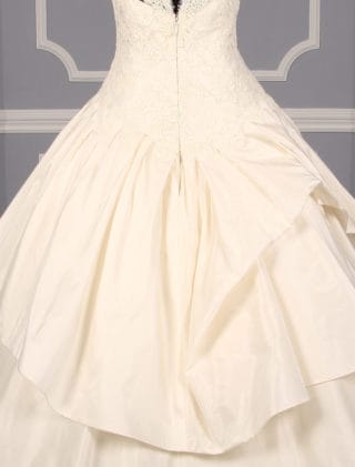 This Kenneth Pool Ina K514 wedding dress is in excellent, ready to wear condition!  The ivory French Alencon lace and silk taffeta fabrics are gorgeous in person.  The sleeveless wedding gown has a sheer bodice, v-back, dropped waist and a ballgown silhouette.  What a wonderful, comfortable gown to dance the night away!