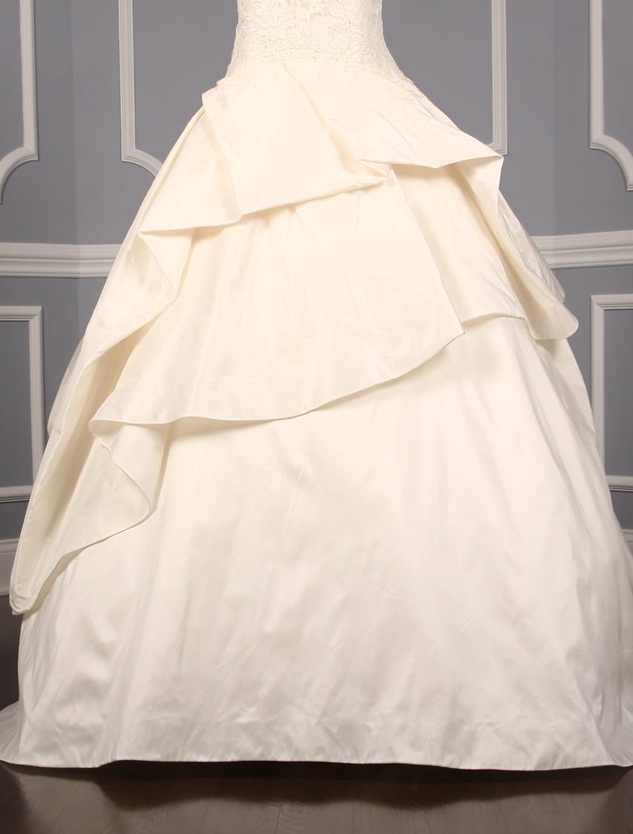 This Kenneth Pool Ina K514 wedding dress is in excellent, ready to wear condition!  The ivory French Alencon lace and silk taffeta fabrics are gorgeous in person.  The sleeveless wedding gown has a sheer bodice, v-back, dropped waist and a ballgown silhouette.  What a wonderful, comfortable gown to dance the night away!