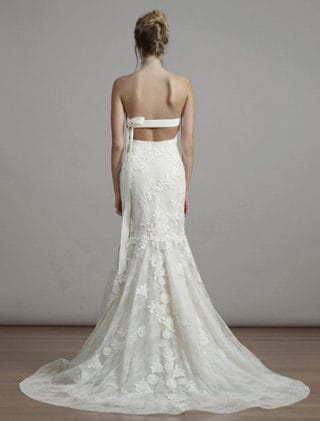 This Liancarlo 6891 wedding dress is Brand New!  The gown is made from incredible Chantilly lace with 3-D Guipure lace detail.  So gorgeous!!  The back of this strapless gown has a bandeau design with a keyhole cut out.  It is ivory/cream and will flatter many skin tones.  This gown is perfect for any type of wedding venue!  This Liancarlo lace wedding dress has a trumpet silhouette with a sweep train.