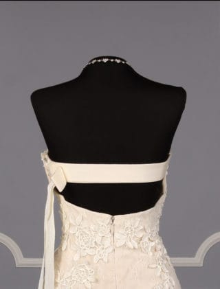 This Liancarlo 6891 wedding dress is Brand New!  The gown is made from incredible Chantilly lace with 3-D Guipure lace detail.  So gorgeous!!  The back of this strapless gown has a bandeau design with a keyhole cut out.  It is ivory/cream and will flatter many skin tones.  This gown is perfect for any type of wedding venue!  This Liancarlo lace wedding dress has a trumpet silhouette with a sweep train.