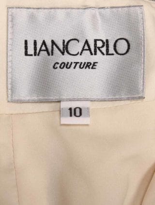 This Liancarlo 6891 wedding dress is Brand New!  The gown is made from incredible Chantilly lace with 3-D Guipure lace detail.  So gorgeous!!  The back of this strapless gown has a bandeau design with a keyhole cut out.  It is ivory/cream and will flatter many skin tones.  This gown is perfect for any type of wedding venue!  This Liancarlo lace wedding dress has a trumpet silhouette with a sweep train.