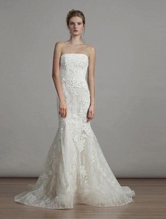 This Liancarlo 6891 wedding dress is Brand New!  The gown is made from incredible Chantilly lace with 3-D Guipure lace detail.  So gorgeous!!  The back of this strapless gown has a bandeau design with a keyhole cut out.  It is ivory/cream and will flatter many skin tones.  This gown is perfect for any type of wedding venue!  This Liancarlo lace wedding dress has a trumpet silhouette with a sweep train.