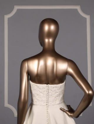 This Sachin & Babi Emma BS1710 X wedding dress is such a classic and timeless style! The ivory corded floral lace and Italian stretch jacquard are both so incredible in person. Perfect for any type of wedding venue! This a-line wedding dress is strapless with a sweep train. The Justina Atelier embellished sash shown in the photos is not included with this gown. Please visit our Accessories section to see our large selection of embellished and non-embellished sashes.