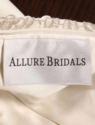 This Allure Bridal 9219 wedding dress is Brand New! The beading on the front and back of this elegant bridal gown is stunning! This Allure Bridal wedding dress is made from luxurious, buttery soft, ivory satin fabric. This satin wedding dress is sleeveless with a v-neck, a keyhole back and a fitted trumpet mermaid silhouette. Extremely elegant and chic! #weddingdressideas #weddingdressshopping #bridalgowns