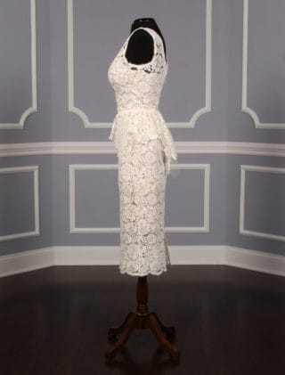 This beautiful Nha Khanh Hana wedding dress is Brand New!  It is made from gorgeous ivory lace with a nude color lining.  This tea length dress is sleeveless with a bateau neckline, a v-back and a sheath silhouette.  A hand trimmed lace peplum is just below the waist.  You could wear this lace dress for your bridal shower, rehearsal dinner, reception, destination wedding, courthouse wedding or any type of wedding venue!  An easy dress to pack for traveling.  It is a great cocktail party dress also.