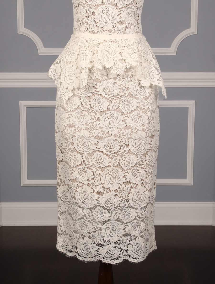 This beautiful Nha Khanh Hana wedding dress is Brand New!  It is made from gorgeous ivory lace with a nude color lining.  This tea length dress is sleeveless with a bateau neckline, a v-back and a sheath silhouette.  A hand trimmed lace peplum is just below the waist.  You could wear this lace dress for your bridal shower, rehearsal dinner, reception, destination wedding, courthouse wedding or any type of wedding venue!  An easy dress to pack for traveling.  It is a great cocktail party dress also.